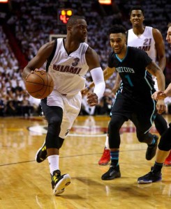 Dwyane Wade No.3 of the Miami Heat drives on Courtney Lee No.1 of the Charlotte Hornets during Game 5 of the Eastern Conference Quarterfinals of the 2016 NBA Playoffs at American Airlines Arena on Thursday in Miami, Florida. AFP PHOTO