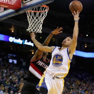 Stephen Curry No.30 of the Golden State Warriors goes up for a shot against Maurice Harkless No.4 of the Portland Trail Blazers at ORACLE Arena on Monday in Oakland, California. AFP PHOTO