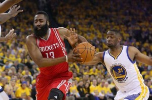 James Harden No.13 of the Houston Rockets drives on Ian Clark No.21 of the Golden State Warriors in Game Five of the Western Conference Quarterfinals during the 2016 NBA Playoffs at ORACLE Arena on Thursday in Oakland, California.  AFP PHOTO 