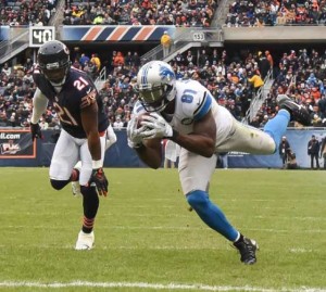 Detroit Lions’ Calvin Johnson recieves a pass against Tracy Porter of the Chicago Bears to score a touchdown in the third quarter at Soldier Field on January 3, in Chicago, Illinois. AFP file photo 