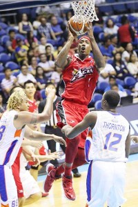 Air walk Al Thorton (foreground, right) and Asi Taulava (left)  of NLEX stand guard against Robert Dozier of Alaska  during a PBA Commissioner’s Cup game at the Smart Araneta Coliseum in  Quezon City on Friday.  PHOTO BY  CZEASAR DANCEL 