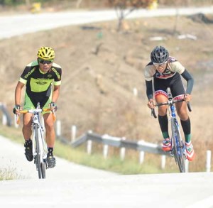 Richard Nebres of Team Ace Sports Group (left) challenges the endurance of Ryan Bravo of 7-Eleven in an uphill phase of the Tour of Tarlac in Tarlac City. CONTRIBUTED PHOTO