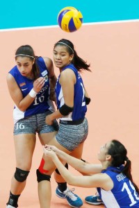 Ateneo’s Alyssa Valdez (right) finds astrategic position with team mate Amy Ahomiro (left) during Game 2 against LaSalle in the UAAP women’s volley ball finals at the Mall of Asia Arena in Pasay City on Wednesday. PHOTO BY CZEASAR DANCEL