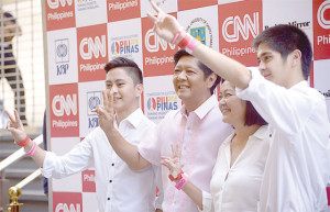 FAMILY AFFAIR Senator Ferdinand “Bongbong” Marcos Jr. enjoys a light moment with his family before the start of the debate at the University of Santo Tomas. CONTRIBUTED PHOTO