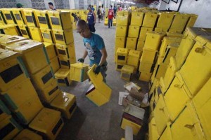 GETTING READY FOR THE BIG DAY A Quezon City maintenance personnel arranges on Sunday, old ballot boxes to be used as drop boxes of voters receipts issued from the vote counting machines on Election Day on May 9. PHOTO BY RUY L. MARTINEZ