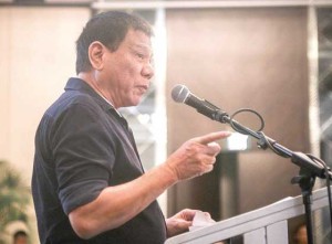 CHANGE WILL BE BLOODY Davao City Mayor Rodrigo Duterte addresses members of the Makati Business Club. The mayor said if he wins, his administration will be bloody. PHOTO BY NAZZI CASTRO