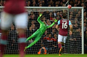 Manchester United’s English striker Marcus Rashford scores past West Ham United’s Irish goalkeeper Darren Randolph during the FA cup quarterfinals replay football match between West Ham United and Manchester United at the Boleyn ground in London on Thursday.  AFP PHOTO 