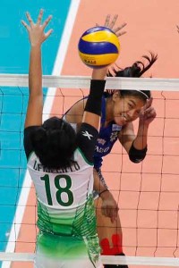 Ateneo de Manila University’s Alyssa Valdez unleashes a powerful hit against De La Salle University’s Cyd Demecillo during Game 2 of the University Athletic Association of the Philippines Season 78 women’s volleyball finals at the Mall of Asia Arena in Pasay City. PHOTO BY CZAR DANCEL