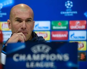 Real Madrid’s French coach Zinedine Zidane listens during a news conference at Valdebebas Sport City in Madrid on Tuesday on the eve of their Champions League second leg football match against Wolsburg.  AFP PHOTO 