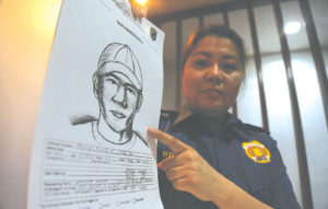 MURDER SUSPECT Manila Police district Public Information office Chief Marissa Bruno shows a cartographic sketch of the alleged suspect in the killing of journalist alex Balcoba. PhOTO by RENE h. DILAN 