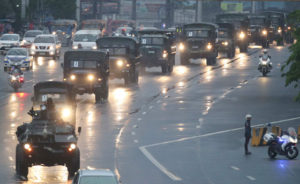 DAWN DELIVERY Military trucks carrying ballot boxes wound their way to the House of Representatives at dawn Tuesday. The Senate and the House will officially start counting votes for President and Vice President today. PHOTO BY RUSSELL PALMA 