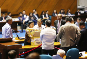 COUNT BEGINS Senate Secretary Oscar Yabes opens the ballot box containing the Certificates of Canvass and Statements of Votes from Davao del Sur, the first to be counted by the National Board of Canvassers. CONTRIBUTED PHOTO 