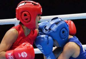 Leona Hui of Singapore (left) fights against Jose Gabuco of the Philippines during their women’s light flyweight semifinal boxing bout at the 28th Southeast Asian Games in Singapore. AFP FILE PHOTO