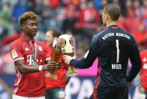 Bayern Munich’s Austrian midfielder David Alaba (left) and Bayern Munich’s goalkeeper Manuel Neuer celebrate with beer after the German first division Bundesliga football match between FC Bayern Munich and Hannover 96 in Munich, southern Germany, on Sunday. AFP PHOTO