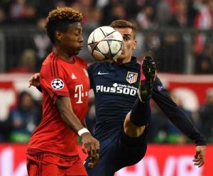 Bayern Munich’s Austrian midfielder David Alaba (left) and Atletico Madrid’s French forward Antoine Griezmann vie for the ball during the UEFA Champions League semifinals, second-leg football match between FC Bayern Munich and Atletico Madrid in Munich, southern Germany, on Wednesday. AFP PHOTO