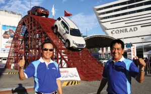 Isuzu Philippines president Hajime Koso (left) and SVP Art Balmadrid giving the thumbs-up sign during the opening of the event.