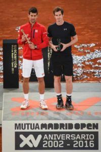 Serbia’s Novak Djokovic (left) poses with his winner’s trophy next to Britain’s Andy Murray during the Madrid Open men’s tennis final at the Caja Magica (Magic Box) sports complex in Madrid on Monday.          AFP PHOTO