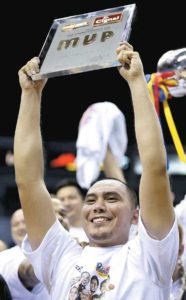 Paul Lee hoists the finals Most Valuable Player trophy after Rain or Shine beat Alaska in Game 6 of the best-of-seven finals of the Philippine Basketball Association Season 41 Commissioner’s Cup at the Araneta Coliseum on Wednesday. CONTRIBUTED PHOTO 