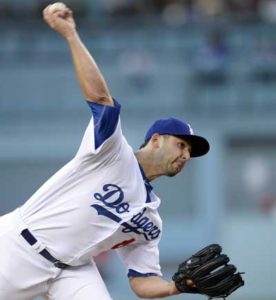 Pitcher Mike Bolsinger No.46 of the Los Angeles Dodgers throws against the Cincinnati Reds during the first inning of the baseball game at Dodger Stadium Wednesday, in Los Angeles, California. AFP PHOTO