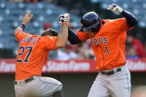 Carlos Correa No.1 is congratulated by Jose Altuve No.27 of the Houston Astros after hitting a three-run home run during the thirteenth inning of a game against the Los Angeles Angels of Anaheim at Angel Stadium of Anaheim on Monday in Anaheim, California. AFP PHOTO