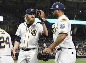 Andrew Cashner No.34 of the San Diego Padres, left, congratulates Matt Kemp No.27 after Kemp made a catch during the fifth inning of a baseball game against the Colorado Rockies at PETCO Park on Wednesday in San Diego, California. AFP PHOTO