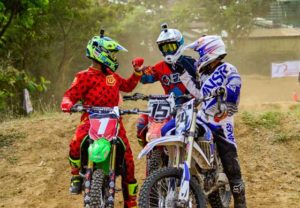 Glenn Aguilar (left) bumps fists with fellow competitors after winning the second leg of the Diamond Motocross series on April 2, 2016 at the MX Messiah Fairgrounds in Taytay, Rizal.  CONTRIBUTED PHOTO 