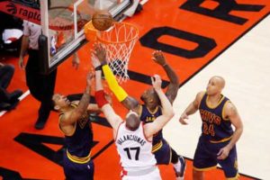 Channing Frye No.9, LeBron James No.23 of the Cleveland Cavaliers and Jonas Valanciunas No.17 of the Toronto Raptors vie for a rebound in the first half of Game 6 of the Eastern Conference Finals during the 2016 NBA Playoffs at Air Canada Centre on May 27, 2016 in Toronto, Canada. AFP PHOTO