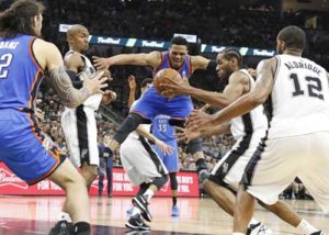 Kawhi Leonard No.2 of the San Antonio Spurs strips Russell Westbrook No.0 of the Oklahoma City Thunder of the ball in game Five of the Western Conference semifinals during the 2016 NBA Playoffs at AT&T Center on Wednesday in San Antonio, Texas. AFP PHOTO