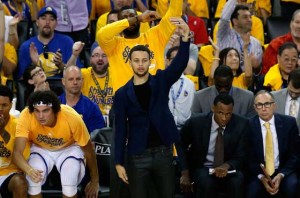 Stephen Curry No.30 of the Golden State Warriors reacts on the bench during the second quarter of their game against the Portland Trail Blazers during Game 1 of the Western Conference semifinals for the 2016 NBA playoffs at ORACLE Arena on Monday in Oakland, California. AFP PHOTO