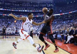 Luol Deng No.9 of the Miami Heat shoots the ball as Kyle Lowry No.7 of the Toronto Raptors defends in the first half of Game One of the Eastern Conference semifinals during the 2016 NBA Playoffs at the Air Canada Center on Wednesday in Toronto, Ontario, Canada. AFP PHOTO
