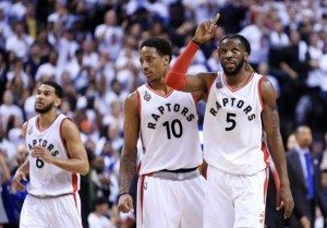 DeMar DeRozan No.10 of the Toronto Raptors congratulates DeMarre Carroll No.5 after Carroll scored a basket in overtime of Game 2 of the Eastern Conference Semifinals during the 2016 NBA Playoffs at the Air Canada Center on Friday in Toronto, Ontario, Canada.  AFP PHOTO