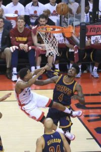 Kyle Lowry No.7 of the Toronto Raptors falls as he shoots in the fourth quarter in Game 4 of the Eastern Conference finals during the 2016 NBA Playoffs at the Air Canada Center on Tuesday in Toronto, Ontario, Canada. AFP PHOTO