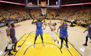Stephen Curry No.30 of the Golden State Warriors goes up for a shot against Enes Kanter No.11 and Kevin Durant No.35 of the Oklahoma City Thunder in Game 7 of the Western Conference finals during the 2016 NBA Playoffs at ORACLE Arena on Tuesday in Oakland, California.  AFP PHOTO 