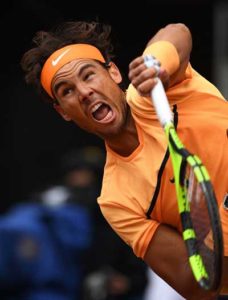 Spanish tennis player Rafael Nadal serves to British tennis player Andy Murray during the men semifinal of Madrid Open tournament at the Caja Magica (Magic Box) sports complex in Madrid on Sunday. AFP PHOTO