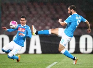 Napoli’s Argentinian-French forward Gonzalo Higuain (right) kicks to score near his teammate Napoli’s Spanish forward Jose Maria Callejon during the Italian Serie A football match between SSC Napoli and Atalanta BC at San Paolo Stadium in Naples on Tuesday.  AFP PHOTO