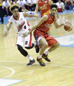 Rain or Shine’s guard Gabe Norwood (right) drives on Alaska’s forward Calvin Abueva during Game 2 of the PBA Commissioner’s Cup finals at Smart Araneta Coliseum in Quezon City on Sunday.  PHOTO BY CZEASAR DANCEL