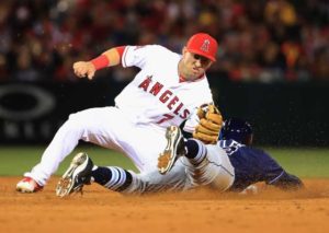 Cliff Pennington (No. 7) of the Los Angeles Angels of Anaheim tags out Brad Miller (No. 13) of the Tampa Bay Rays on an attempted steal during the sixth inning of a baseball game between the Los Angeles Angels of Anaheim and Tampa Bay Rays at Angel Stadium of Anaheim in Anaheim, California. AFP PHOTO