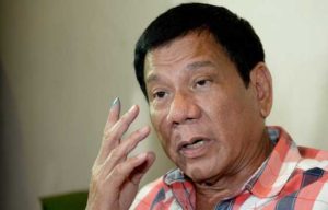  Philippines Presidential frontrunner and Davao City Mayor Rodrigo Duterte gestures as he is interviewed by reporters at a hotel in Davao City. AFP Photo