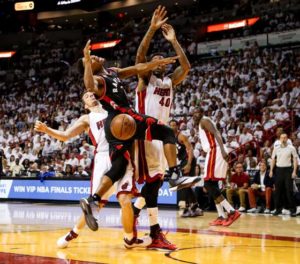 Kyle Lowry (No. 7) of the Toronto Raptors loses control of the ball during the third quarter of the game against the Miami Heat at American Airlines Arena in Miami, Florida.  AFP PHOTO