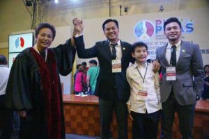 NEW LEGISLATOR Michael “Mikee” Romero is proclaimed as representative of 1Pacman party-list. With him are sons Santi and Miguel. CONTRIBUTED PHOTO