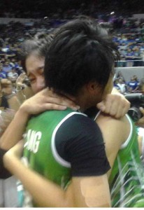 Graduating players Ara Galang (left) and Mika Reyes hug each other after winning the University Athletic Association of the Philippines Season 78 women’s volleyball crown on Saturday at the Araneta Coliseum.  CONTRIBUTED PHOTO