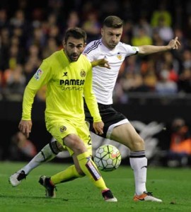 Villarreal’s forward Adrian Lopez (left) vies with Valencia’s Brazilian defender Guillerme Siqueira during the Spanish league football match Valencia CF vs Villarreal CF at the Mestalla stadium in Valencia on Monday. AFP PHOTO