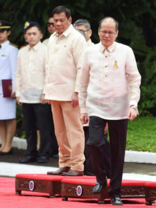 FAREWELL President Benigno Aquino 3rd walks toward his car as his successor looks on during departure ceremony in Malacañang on Thursday. AFP PHOTO