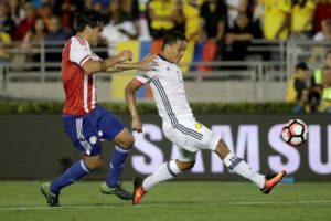 Carlos Bacca No.7 of Colombia controls the ball past Gustavo Gomez No.3 of Paraguay during the second half of a 2016 Copa America Centenario Group A match between Columbia and Paraguay at Rose Bowl on Wednesday in Pasadena, California.  AFP PHOTO