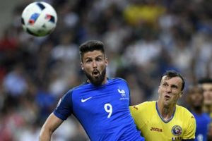 France’s forward Olivier Giroud  (left) vies for the ball with Romania’s defender Vlad Chiriches during the Euro 2016 group A football match between France and Romania at  Stade de France, in Saint-Denis,  north of Paris, on Saturday.  France beat Romania 2-1 in the  opening match of the  Euro 2016. AFP PHOTO