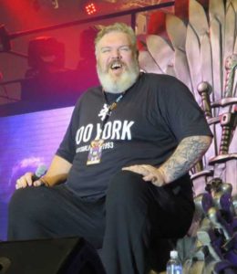 Kristian Nairn aka Hodor sits on the ‘Iron Throne’ at Toy Con 2016