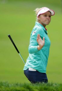 Brooke Henderson of Canada acknowledges the gallery after hitting her bunker shot on the sixth hole during the final round of the KPMG Women’s PGA Championship at Sahalee Country Club on Monday in Sammamish, Washington.  AFP PHOTO