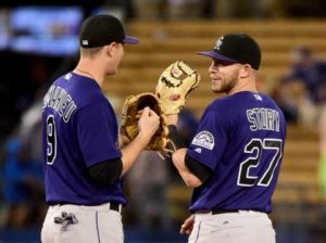 Trevor Story No.27 of the Colorado Rockies reacts with DJ LeMahieu no.9 after the final out and a 6-1 win over the Los Angeles Dodgers at Dodger Stadium on Tuesday in Los Angeles, California. AFP PHOTO