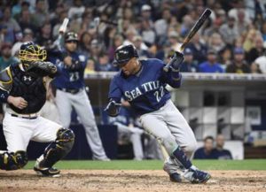 Robinson Cano No.22 of the Seattle Mariners is hit with a pitch as Derek Norris No.3 of the San Diego Padres looks on during the seventh inning of a baseball game at PETCO Park on Friday in San Diego, California. AFP PHOTO