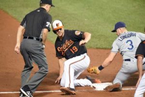 ??Chris Davis No.19 of the Baltimore Orioles beats the tag by Evan Longoria No.3 of the Tampa Bay Rays on a sacifric fly by Matt Wieters No.32 of the Baltimore Orioles [not pictured] in the sixth inning during a baseball game at Oriole Park at Camden Yards on Saturday in Baltimore, Maryland. AFP PHOTO